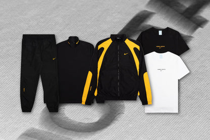Nike x Nocta NRG AU S/S Top ESS - Black/University Gold